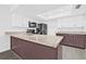 Bright kitchen featuring granite counters, stainless steel appliances, and a breakfast bar at 4532 Cedarwood Village Dr, Tampa, FL 33624