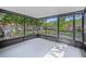 Enclosed patio with concrete flooring and a view to the backyard at 4532 Cedarwood Village Dr, Tampa, FL 33624