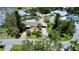 Aerial view of the property showcasing its landscaping, pool and proximity to neighboring homes at 4735 Baywood Point S Dr, Gulfport, FL 33711