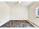 Empty bedroom with ceiling fan and window, ready for personalization at 4735 Baywood Point S Dr, Gulfport, FL 33711