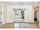 Bright living room featuring French doors leading to the backyard and tile floors at 4735 Baywood Point S Dr, Gulfport, FL 33711