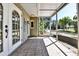Welcoming screened porch showcasing tile flooring and bright, airy atmosphere at 4735 Baywood Point S Dr, Gulfport, FL 33711