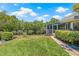 Lush backyard featuring green grass and well-maintained landscaping, offering a serene outdoor space at 5270 White Sand Ne Cir, St Petersburg, FL 33703