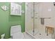 Clean bathroom featuring tiled shower, toilet, and ample storage at 5270 White Sand Ne Cir, St Petersburg, FL 33703