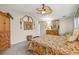 Light-filled bedroom featuring vaulted ceilings, ceiling fan and ample space at 5270 White Sand Ne Cir, St Petersburg, FL 33703