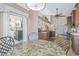 Bright breakfast nook featuring elegant furnishings, with a seamless transition to the kitchen at 5270 White Sand Ne Cir, St Petersburg, FL 33703