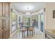 Cozy breakfast nook surrounded by windows providing natural light and views of the outdoors at 5270 White Sand Ne Cir, St Petersburg, FL 33703