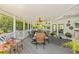 Spacious covered patio featuring a ceiling fan and outdoor dining set at 5270 White Sand Ne Cir, St Petersburg, FL 33703