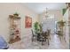 Inviting dining area featuring tile floors, a decorative chandelier, and an abundance of natural light at 5270 White Sand Ne Cir, St Petersburg, FL 33703