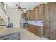 Bright kitchen featuring wooden cabinets and stainless steel appliances, with seamless transition to the dining area at 5270 White Sand Ne Cir, St Petersburg, FL 33703