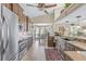 Open kitchen featuring granite countertops, stainless steel appliances, and a breakfast nook at 5270 White Sand Ne Cir, St Petersburg, FL 33703
