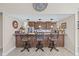 Kitchen bar area with granite countertops and seating for three at 5270 White Sand Ne Cir, St Petersburg, FL 33703
