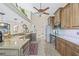 Bright kitchen featuring granite countertops, stainless steel appliances, and seamlessly connecting spaces at 5270 White Sand Ne Cir, St Petersburg, FL 33703