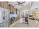 Updated kitchen with stainless steel appliances, granite countertops, and tile backsplash at 5270 White Sand Ne Cir, St Petersburg, FL 33703