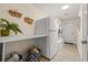 Functional laundry area includes a washer, dryer, utility sink and ample counter space at 5270 White Sand Ne Cir, St Petersburg, FL 33703