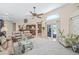 Bright living room with vaulted ceilings, ceiling fan, and large windows at 5270 White Sand Ne Cir, St Petersburg, FL 33703