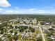 Wide-angle aerial view of a suburban area showcasing a mix of residential buildings, green spaces, and infrastructure at 6209 S Harold Ave, Tampa, FL 33616