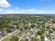 Picturesque aerial view of a sprawling residential community with a mix of homes and mature trees at 6209 S Harold Ave, Tampa, FL 33616