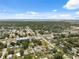 Aerial view of a city neighborhood, capturing a blend of homes, businesses, and a distant waterfront at 6209 S Harold Ave, Tampa, FL 33616