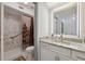 Clean bathroom with marble shower at 6209 S Harold Ave, Tampa, FL 33616