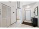 Bright entryway features tile flooring, coat closet and access to other rooms in the home at 6209 S Harold Ave, Tampa, FL 33616