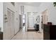 Bright entryway features tile flooring, coat closet and access to other rooms in the home at 6209 S Harold Ave, Tampa, FL 33616
