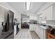 Spacious kitchen featuring stainless steel appliances and bright dining area at 6209 S Harold Ave, Tampa, FL 33616