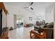 Bright living room featuring tile flooring, sliding glass doors, and neutral decor at 6209 S Harold Ave, Tampa, FL 33616
