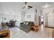 Cozy living room featuring tile flooring, neutral paint, and views into dining area at 6209 S Harold Ave, Tampa, FL 33616