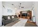 Comfortable living room featuring tile flooring, neutral paint, and ceiling fan at 6209 S Harold Ave, Tampa, FL 33616