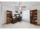 Home office with tile floor and dark brown furniture at 6209 S Harold Ave, Tampa, FL 33616