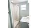 Updated bathroom with tile shower, modern vanity, and plenty of natural light at 690 Fox St, Longboat Key, FL 34228