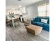 Open-concept living area flows into a modern kitchen with island seating and stylish decor at 690 Fox St, Longboat Key, FL 34228