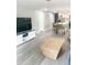 Spacious living area with views into the modern kitchen and island seating at 690 Fox St, Longboat Key, FL 34228