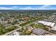 An aerial view showcases the location, with the canal to the east, and a shopping center nearby at 762 77Th N Ave, St Petersburg, FL 33702