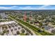 An aerial neighborhood view shows the home's proximity to a shopping center and waterway to the east at 762 77Th N Ave, St Petersburg, FL 33702