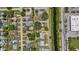 A high aerial view of the canal-front neighborhood showing the street grid, homes, and lush greenery at 762 77Th N Ave, St Petersburg, FL 33702