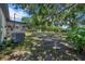 The spacious back yard is completed with mature trees and a covered space at 762 77Th N Ave, St Petersburg, FL 33702