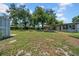 The well-maintained back yard contains mature trees, fire pit, and covered entertaining space at 762 77Th N Ave, St Petersburg, FL 33702