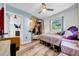 Bedroom showcasing a closet, bed, wood floors, and a view into the living area at 762 77Th N Ave, St Petersburg, FL 33702