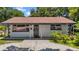 Inviting single-story home with a covered entrance and well-maintained front yard at 762 77Th N Ave, St Petersburg, FL 33702