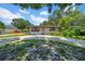 Landscaped single-story home featuring a concrete driveway and well-maintained front yard at 762 77Th N Ave, St Petersburg, FL 33702