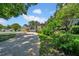 Charming single-story home with lush landscaping and a concrete driveway at 762 77Th N Ave, St Petersburg, FL 33702