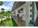 Inviting front porch with tiled floor and outdoor seating at 762 77Th N Ave, St Petersburg, FL 33702