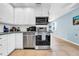 Well-equipped kitchen with stainless steel appliances and ample cabinet space at 762 77Th N Ave, St Petersburg, FL 33702