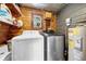 Utility room with modern washer, dryer and water heater at 762 77Th N Ave, St Petersburg, FL 33702
