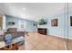 Spacious living room featuring neutral walls, tile flooring, and a comfortable sectional sofa at 762 77Th N Ave, St Petersburg, FL 33702