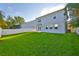 Expansive backyard showcasing well-maintained lawn, offering ample space for recreation at 7703 S West Shore Blvd, Tampa, FL 33616