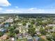 Aerial view showcasing the neighborhood, the tree coverage, and roadways at 8306 N Gomez Ave, Tampa, FL 33614