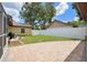 Spacious backyard featuring a patio area, well-maintained lawn, and a white privacy fence at 8306 N Gomez Ave, Tampa, FL 33614